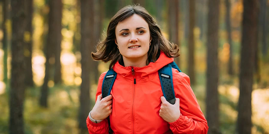 Active young adult woman hiking. cbd for wellness in women's health. CBD for women.