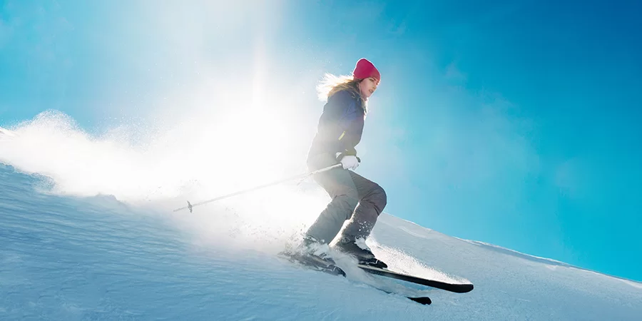 skier is riding from snow hill. cbd for wellness.